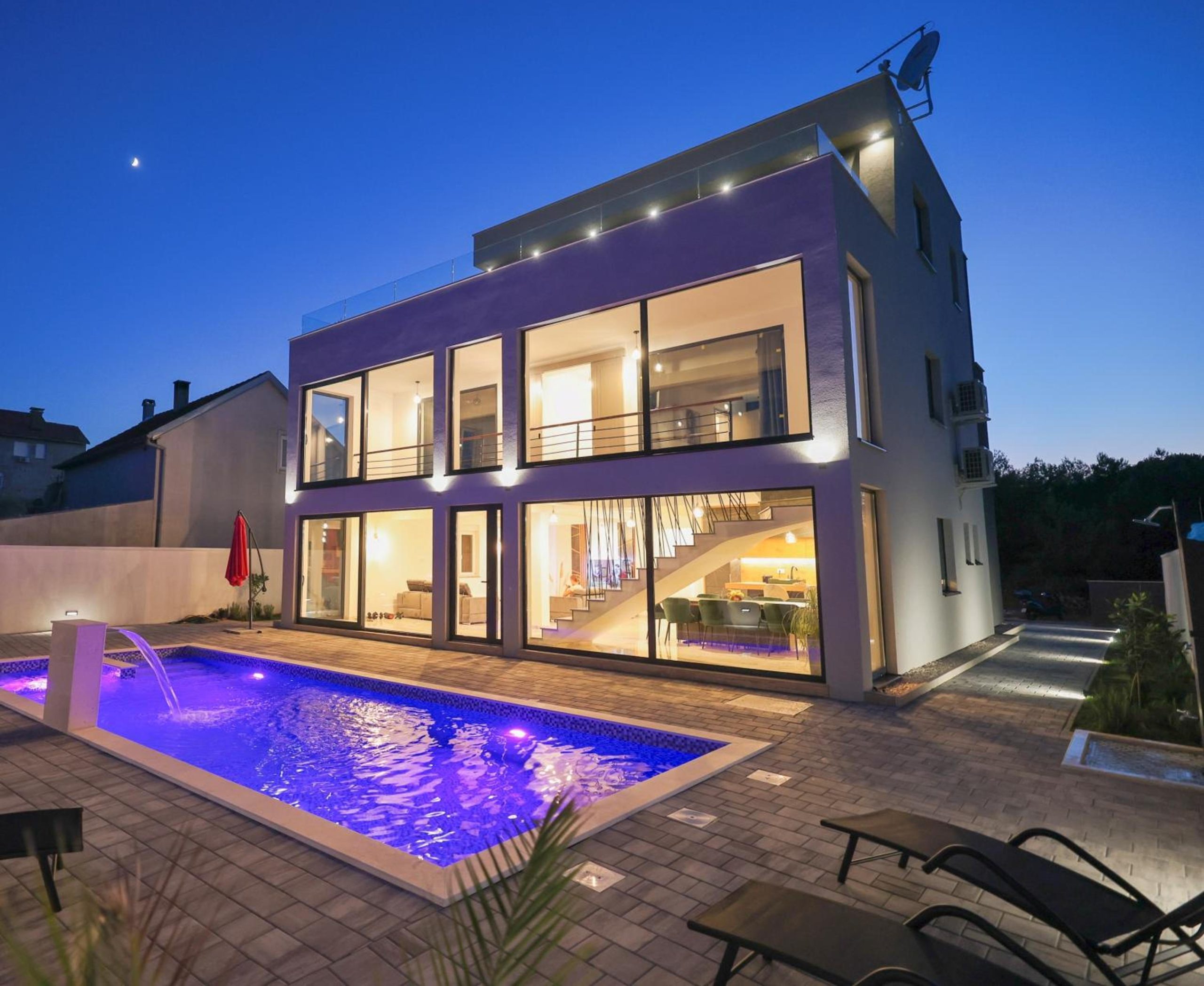 Rhapsody In Green - villa and pool at night